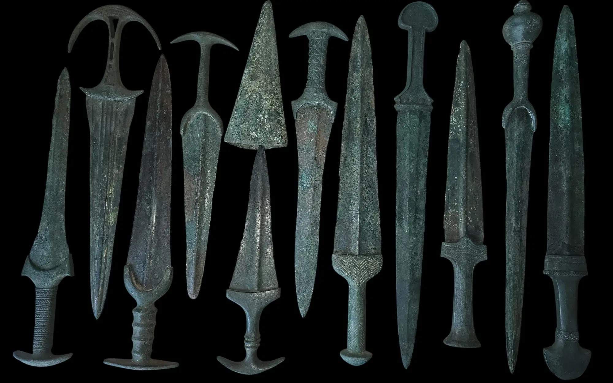 Collection of ancient bronze swords and daggers